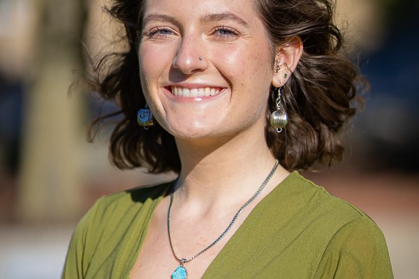 Briley Rossiter posing for a headshot for her campus job as a Peer Wellness Coach.