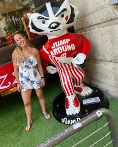 Leah Henning with the Game Day Bucky statue outside the University Bookstore.