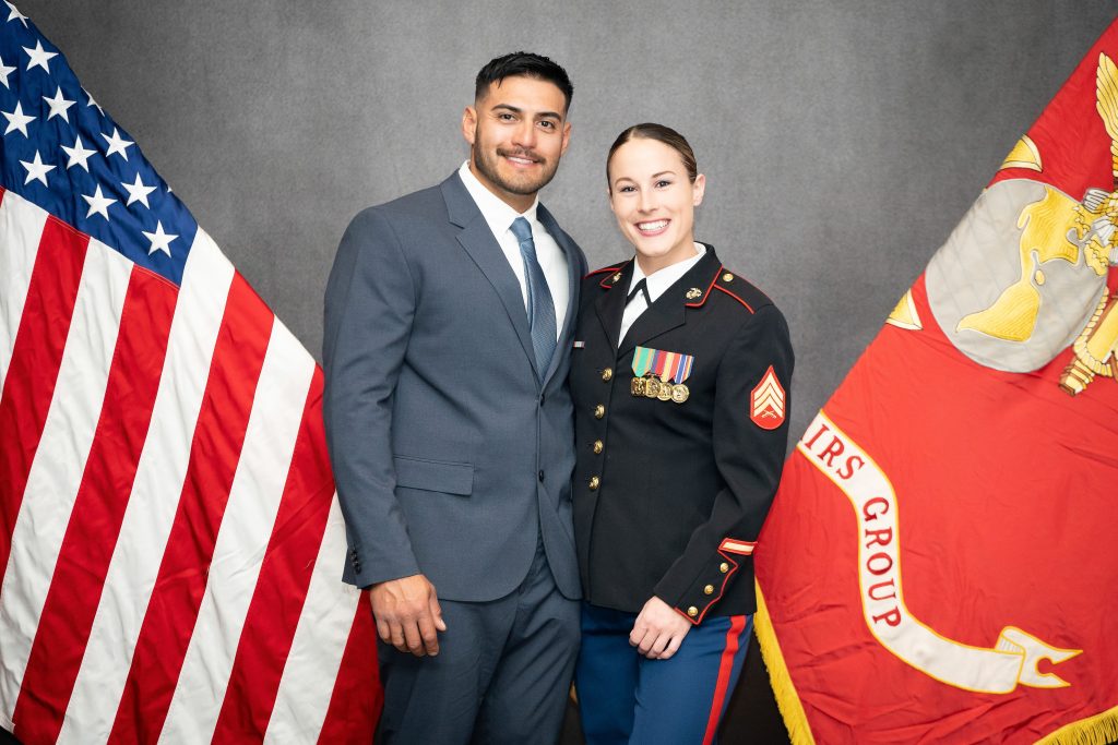 Leah Henning wearing her dress blue uniform with a guest at a Marine Corps Birthday Ball.