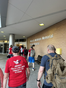 Community members and uw-madison students walking into the VA Hospital.