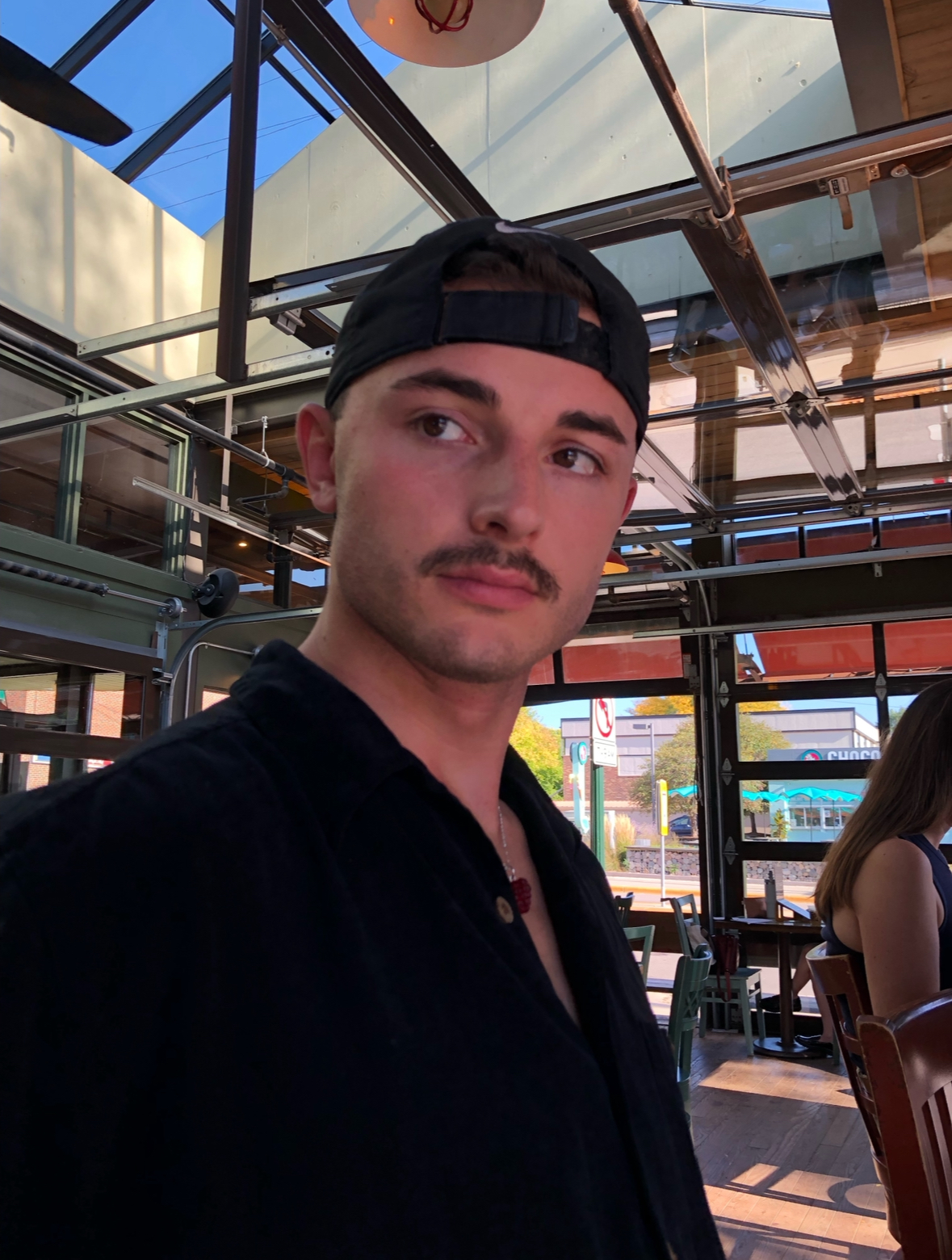 George Vondriska in a photo with a black baseball cap and black shirt.