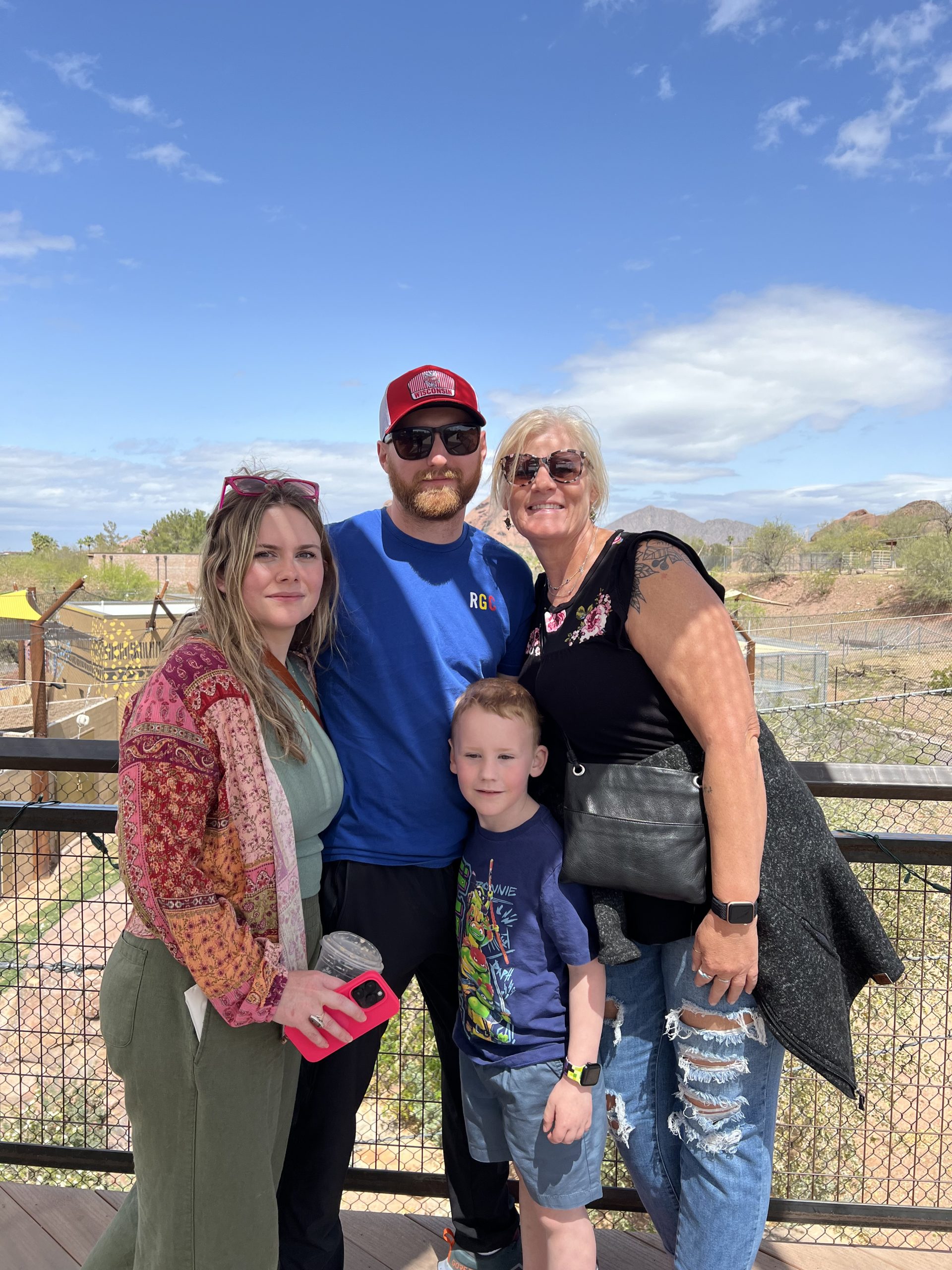 Andrew Ledoux and three family members (two girls and one young boy) posing for a picture.